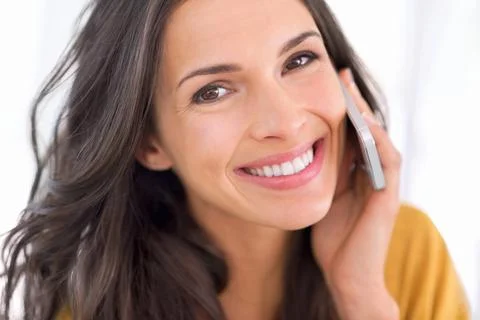 Getting good telephonic support. a gorgeous young woman on a phone. Stock Photos