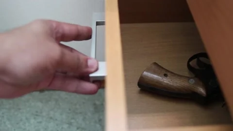 Getting Gun Out Of Drawer Stock Footage 157656300