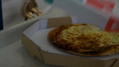 Getting home with a pizza box Stock Footage 128546406