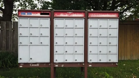 Getting mail from a community mail box Stock Footage 135769751