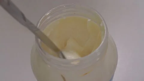 Getting Mayo / Mayonnaise from Jar with a Knife Stock Footage