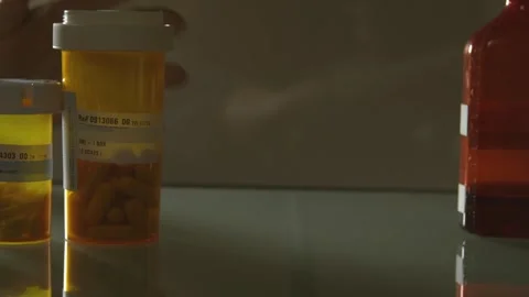 Getting Medication From a Cabinet Stock Footage 243617152