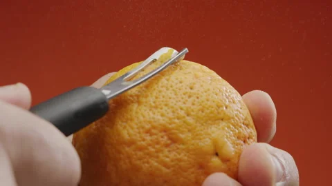 Getting orange peel with a special kitchen tool. Video stock 301517791