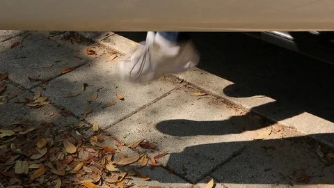Getting out of car. Stepping onto sidewalk. static cu Stock Footage 106835023