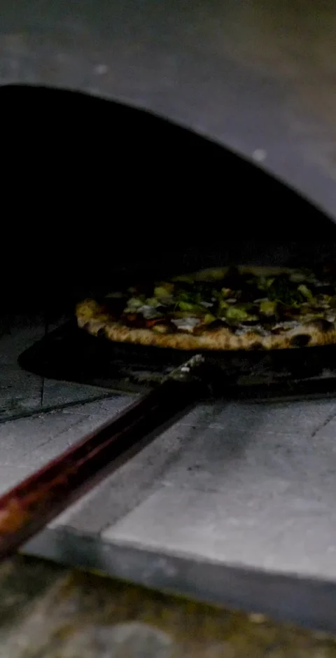 Getting Pizza Pie Out Of The Oven Vertical Clip Stock Footage 138714268