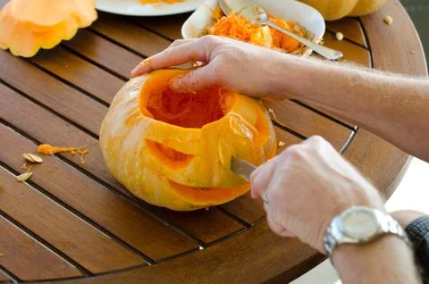 Getting pumpkin ready for halloween Stock Photos