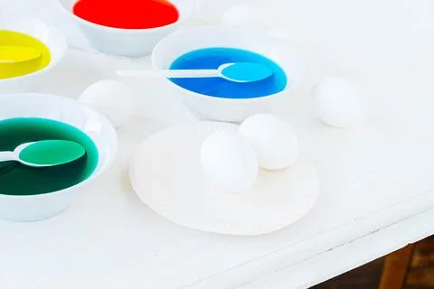 Getting ready for Easter with liquid food coloring. Different colors in Stock Photos