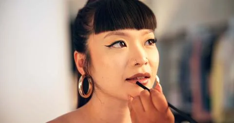 Getting ready, makeup and stylist with model in studio for behind the scene.. Stock Photos