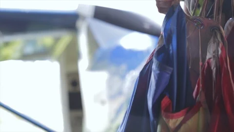 Getting ready to skydive packing parachute close up. Man folding skydive canopy  스톡 동영상 116062047