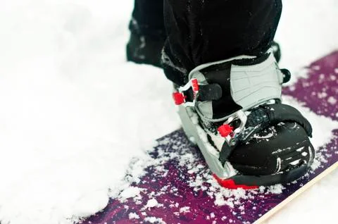Getting ready to snowboard. Fotos de archivo
