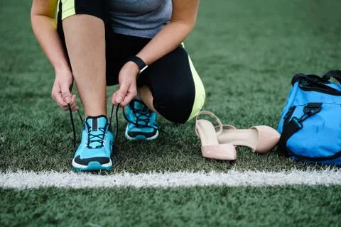 Getting ready for training. The concept of female feet after work. Stock Photos