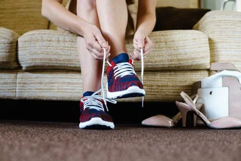 Getting ready for training. The concept of female feet after work. Stock Photos