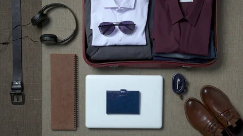 Getting ready for a trip and packing a suitcase Stock-Footage 70438417