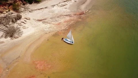 Getting into Sailboat Aerial Stock Footage 76922233