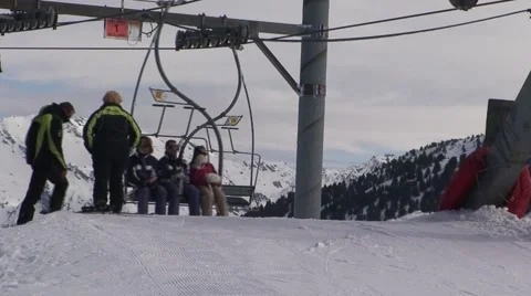 Getting off a Ski Lift Stock Footage 1038134