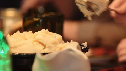 Getting a spoonful of mashed potatoes Stock Footage 97534086