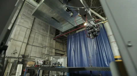 Getting started welding robot. Slide from the gate at the welding robot Stock Footage 47486655