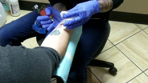 Getting a tattoo Stock Footage 44440993