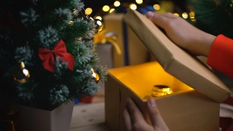 Getting Vintage Camera from Christmas Gift Stock Footage 96483553