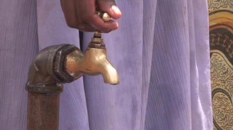 Getting water from a tap Stock Footage 729458