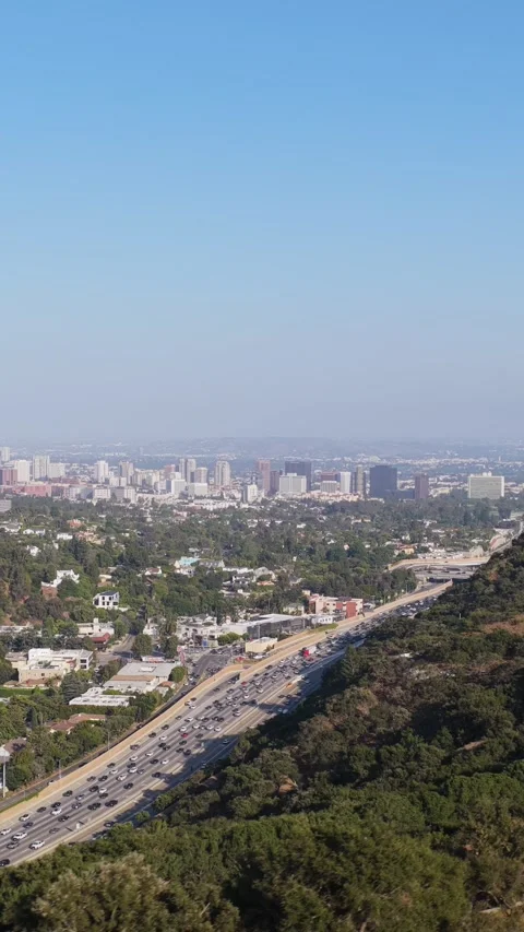 Getty Center architecture overlooking hazy Los Angeles skyline with heavy traffi Stock Footage 337417418