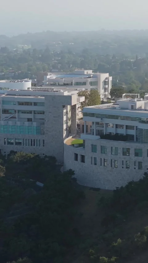 Getty Center modern architecture on Santa Monica Mountains hill with downtown Lo Stock Footage 337417437