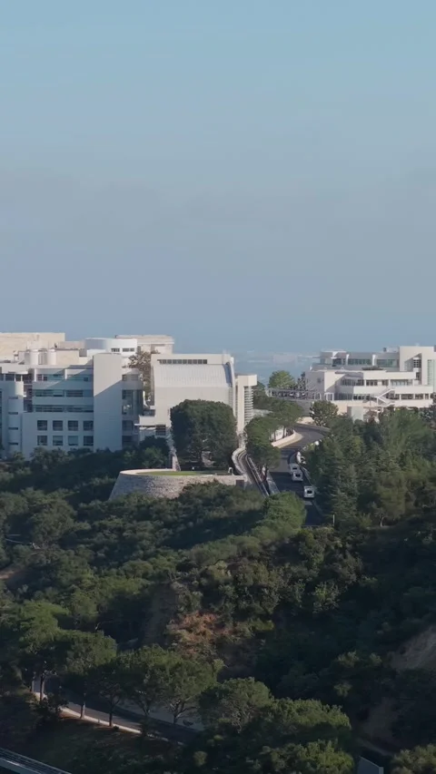 Getty Center museum orbiting over Santa Monica Mountains with Los Angeles citysc Stock Footage 337417422