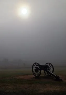 Gettysburg Cannon in Heavy Fog with Sun Peaking Stock Photos