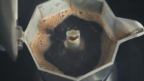 Geyser coffee maker close up. Making Italian espresso with a moka pot. Stock Footage 330947768