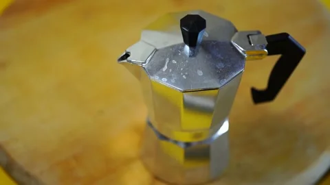 Geyser coffee maker in the hands of a man. Loading ground coffee Stock Footage 135232944