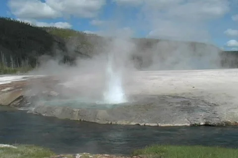 Geyser by river Stock Footage 116182