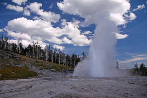 The geyser which erupts in the clouds Stock Photos