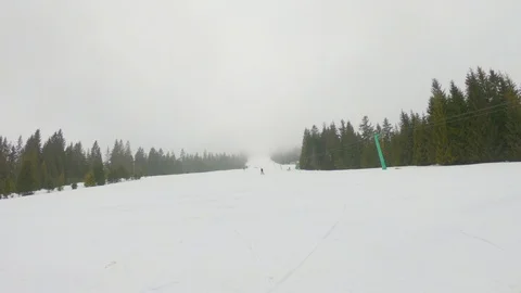 GH010186A young guy pulls off the mountain on skis and smiles Video stock 88005415