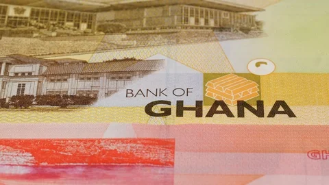 Ghana cedi notes fast tracking. Ghanaian money. Slider shot, low angle. 4K Stock Footage 126007128