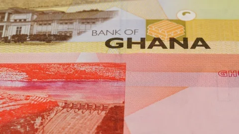 Ghana cedi notes slow tracking. Ghanaian currency. Slider shot, low angle. 4K Stock Footage 126007231