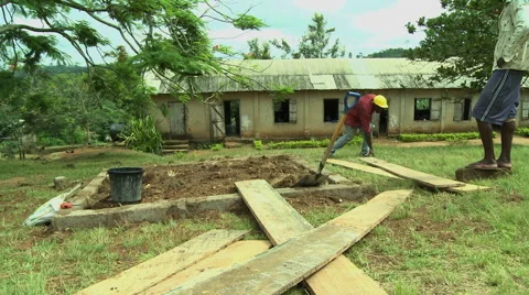 GHANA WIDE ON WORKER BUILDING PLATFORM OF PAKRO SCHOOL Stock Footage 57830883