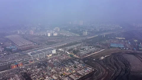 Ghazipur Landfill Mountain|Garbage Dump With Traffic &amp; City|Aerial Reveal Stock-Footage 155283326