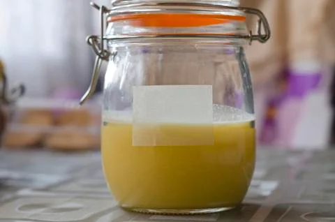 Ghee in Jar on the table in the kitchen Stock Photos