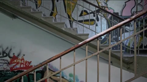 Ghetto staircase railing with graffiti on the wall. Stock Footage 287915853