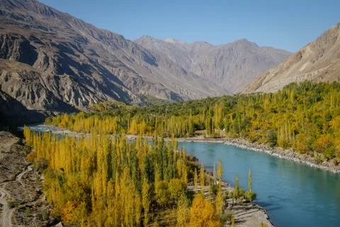 Ghizer river flowing through forest in Gahkuch. Gilgit Baltistan, Pakistan. Stock Photos