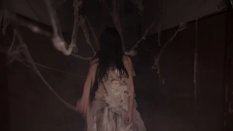 Ghost angry spirit in the corridor with many spider web. Woman in white dress in Stock Footage 283370783