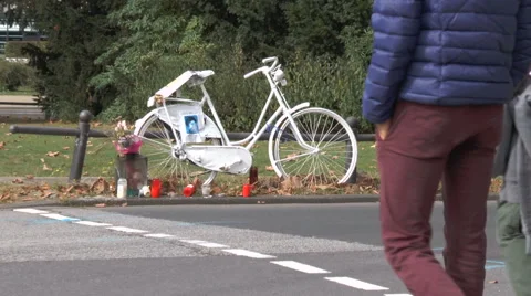 A ghost bike roadside memorial on the corner of a crossroads Stock Footage