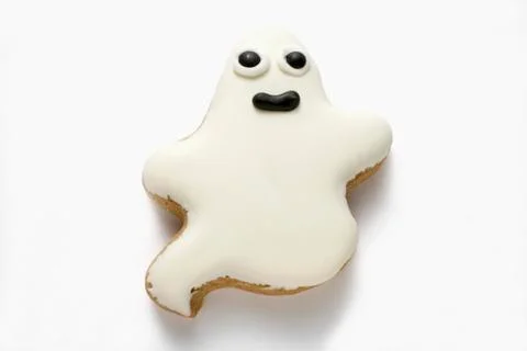 A ghost biscuit with white icing for Halloween Stock Photos