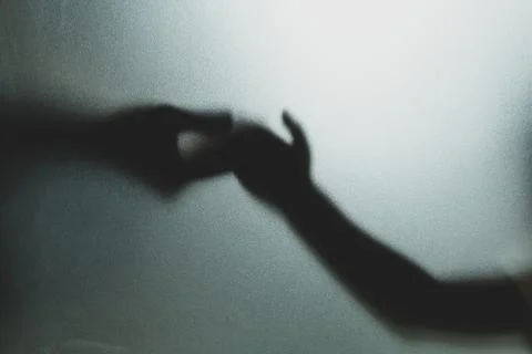 Ghost concept shadow of hand behind the matte glass blurry hand and body 스톡 사진