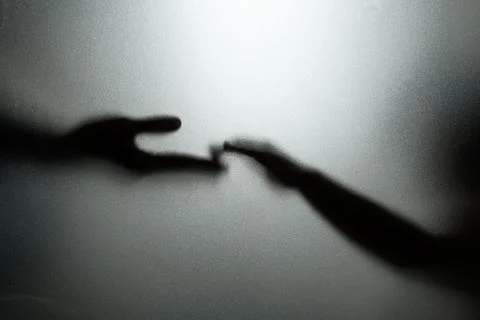 Ghost concept shadow of hand behind the matte glass blurry hand and body Stock Photos
