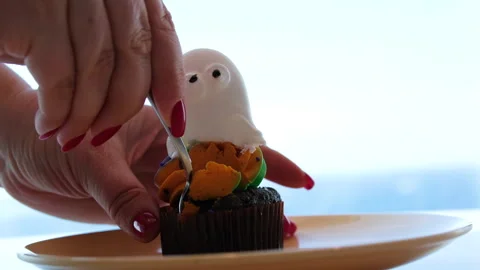 Ghost cookie Left to right zenithal pan showing Halloween shaped cookies, cups Stock Footage 314099365