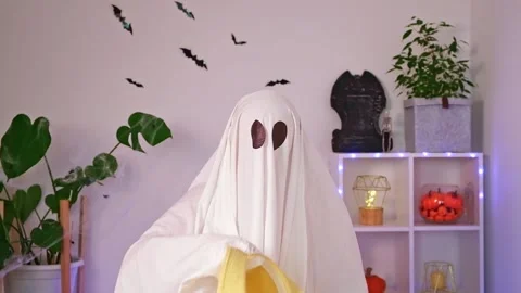 Ghost is getting ready vacation. Ghost goes on trip, travel, trip. Halloween Stock Footage 219966072