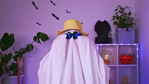 Ghost is getting ready vacation. Ghost goes on trip, travel, trip. Halloween Stock Footage 233011289