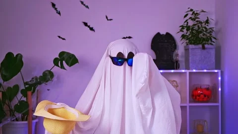 Ghost is getting ready vacation. Ghost goes on trip, travel, trip. Halloween Stock Footage 233011311