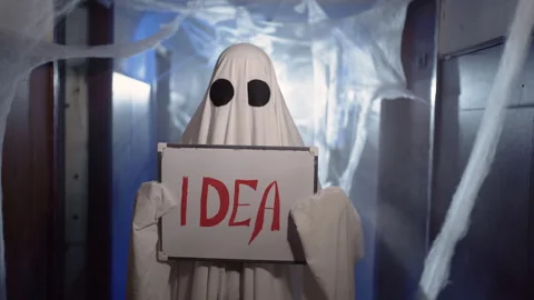 Ghost holding idea sign hallway dark corridor Stock Footage 313669380